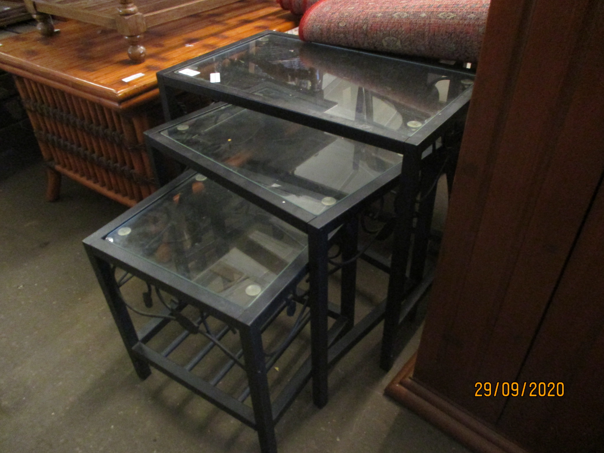 NEST OF THREE MODERN METAL FRAMED TABLES WITH GLASS INSETS, LARGEST 52CM WIDE