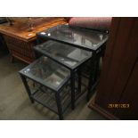 NEST OF THREE MODERN METAL FRAMED TABLES WITH GLASS INSETS, LARGEST 52CM WIDE
