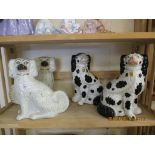 GROUP OF STAFFORDSHIRE POODLES, TWO WITH A WHITE AND GILT DESIGN, TWO WITH A SPONGED BLACK AND