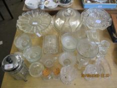 QUANTITY OF GLASS WARE INCLUDING CAKE STANDS AND COVERS, GLASS JUGS, CHEESE DISH ETC