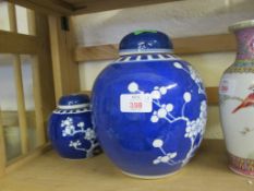 LARGE CHINESE GINGER JAR WITH PRUNUS DECORATION, TOGETHER WITH A SMALLER EXAMPLE