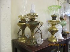 GROUP OF THREE METAL LAMPS, TWO WITH GLASS FUNNELS