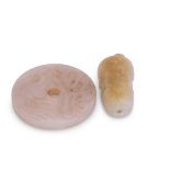 Chinese jade model of a cat, the white jade with russet occlusions, together with a circular disc