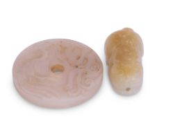 Chinese jade model of a cat, the white jade with russet occlusions, together with a circular disc