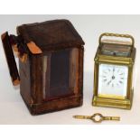 Victorian brass mantel clock with repeating movement, stamped "AMS" together with carrying case (