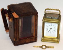 Victorian brass mantel clock with repeating movement, stamped "AMS" together with carrying case (