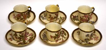 Group of six Worcester cups and saucers, the blush ground body decorated in flowers with gilt