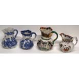Group of four jugs, two Mason's jugs with blue and white designs and two others (4)