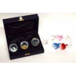 Group of Swarovski animals including a squirrel and a mouse, models of cows in various colours and