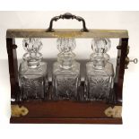Vintage mahogany cased and silver plated mounted three-bottle tantalus, 34cm wide