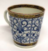 18th century Worcester coffee cup with shaped handle, decorated in underglaze blue with the music