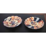 Pair of Japanese porcelain dishes, of fluted shape with typical Imari design
