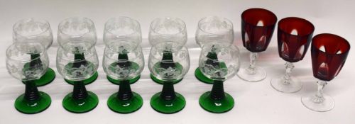 Group of Bohemian style wine glasses with engraved floral design (10), together with three cranberry