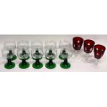 Group of Bohemian style wine glasses with engraved floral design (10), together with three cranberry