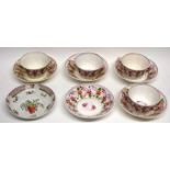 Part English pottery lustre ware tea set with typical floral design comprising 5 cups and 4 saucers,