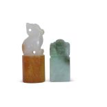 Chinese jade carving of a mythical beast on cylindrical base, together with a green jade seal, the