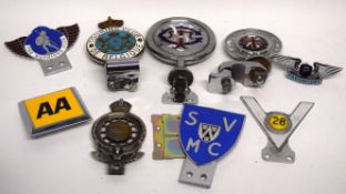 Box of vintage caravans/car badges