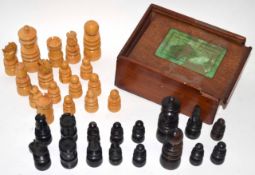 Box containing an ebonised vintage chess set of Staunton type pattern