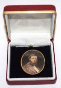 Vintage oval pendant inset with a print depicting a head and shoulders of a gentleman