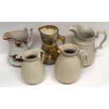 Group of late 19th century pottery jugs including a cock-fighting jug by Ellsmore & Forster with