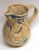 Mid-20th century Beswick ware jug shape 676, decorated in relief with rabbits in a floral setting