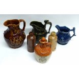 Group of pottery jugs, two by Wood & Sons, a further liqueur whisky flask and cover, and lemonade