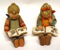 Two Goebbels figures of seated children reading books