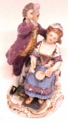 Late 19th/early 20th century Meissen group of two children with pipes, crossed swords mark to