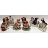 Group of Staffordshire wares including models of two cows and calves on oval bases, three