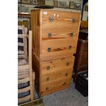 PAIR OF PINE THREE DRAWER BEDSIDE CABINETS WITH MILITARY STYLE HANDLES, 53CM WIDE