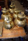 FIVE BRASS JUGS AND COVERS