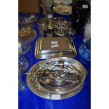 QUANTITY OF PLATED WARES COMPRISING TWO TANKARDS, SERVING DISHES ETC