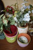 GROUP OF POTTERY JARDINIERES AND SOME WITH PLASTIC FLOWERS