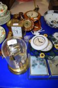 MODERN CLOCK IN GLASS DOME AND OTHER CLOCKS AND A BAROMETER