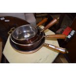 GRADUATED SET OF FOUR MODERN COPPER PLATED COOKING PANS