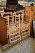 SET OF FOUR PINE SLAT BACK KITCHEN CHAIRS WITH RUSH SEATS