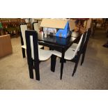 BLACK LACQUERED DINING SUITE OF TABLE AND SIX CHAIRS