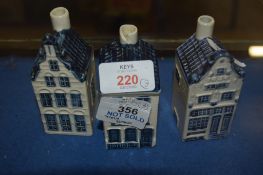 THREE POTTERY COTTAGES WITH BLUE AND WHITE DECORATION