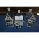 THREE POTTERY COTTAGES WITH BLUE AND WHITE DECORATION