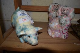 TWO CERAMIC DOGS AND A MODEL OF A PIG