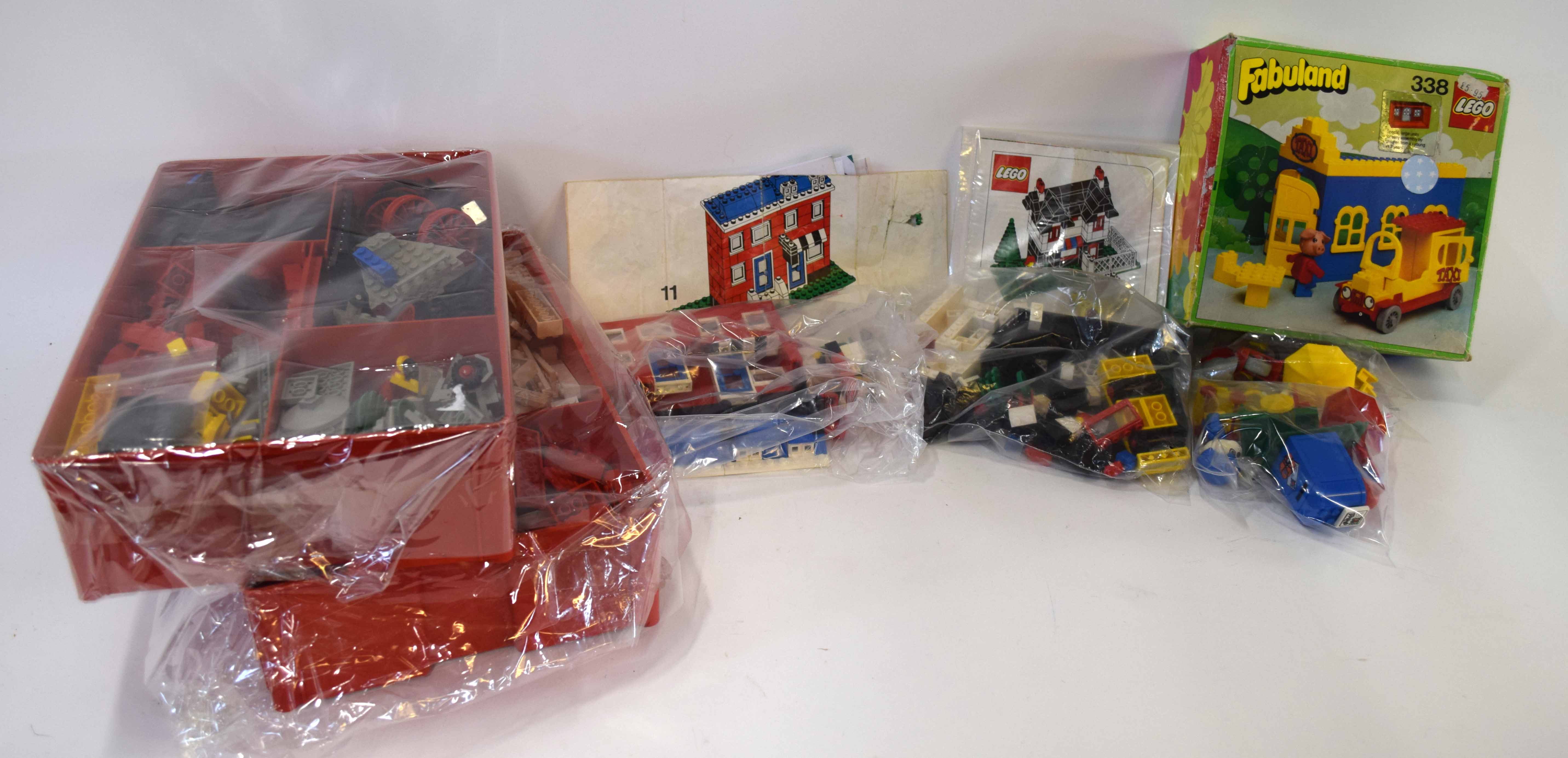 Quantity of vintage Lego to include two trays of assorted bricks and pieces, Lego Weetabix house set
