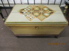 Victorian mahogany based and upholstered ottoman (pine lined), the wool work top featuring geometric