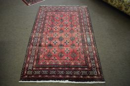 Modern Caucasian carpet with multi-gull border, central panel of lozenges, mainly red field, 181 x