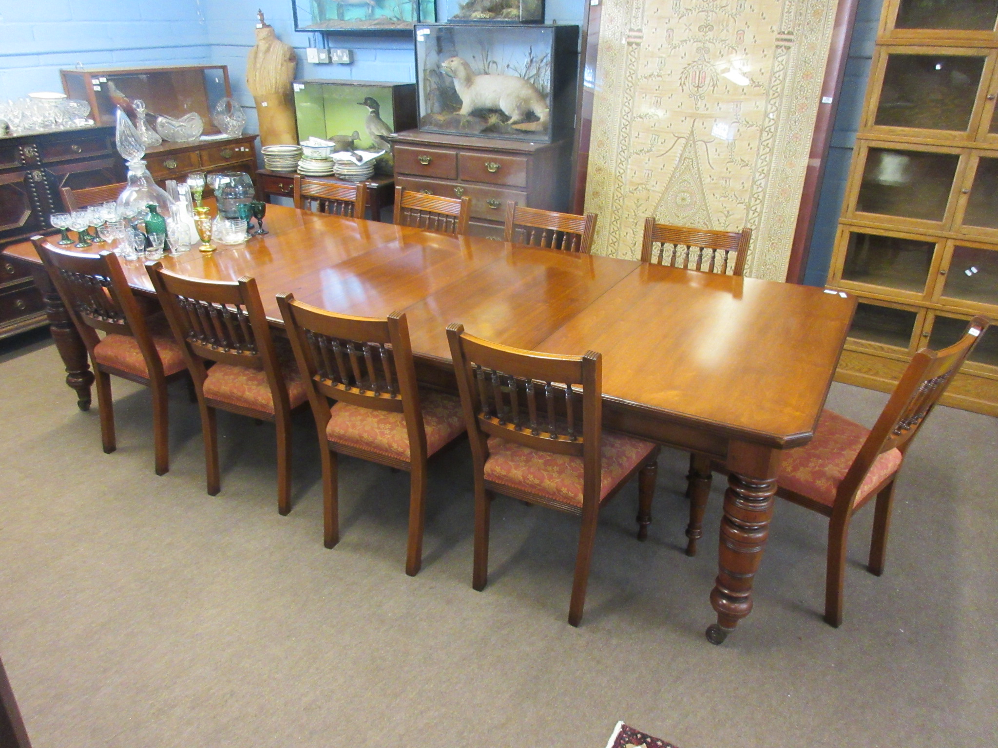 Late 19th century mahogany dining chairs all with spindle backs and rust floral upholstered seats (