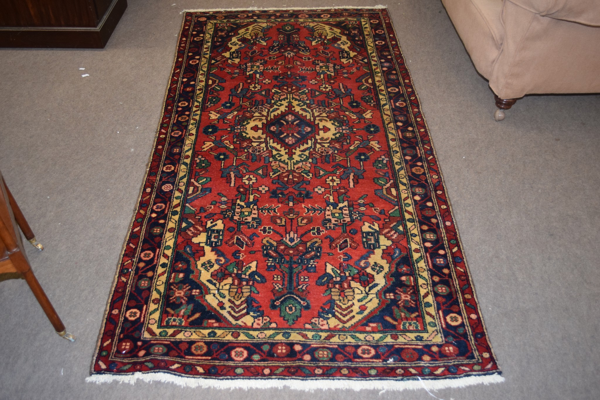 Caucasian carpet with central geometric lozenge, triple gull border, mainly red and blue field,