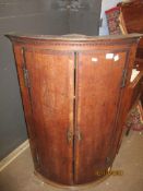 18th century oak bow fronted corner cupboard, 69cm wide