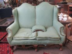 Early 20th century double arch back green upholstered two-seater sofa, 149cm wide