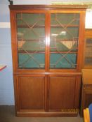 Mahogany bookcase cabinet with dentil corners over astragal glazed doors and cupboard base, 223cm