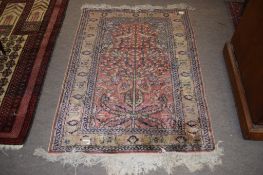 Small Caucasian rug, multi-gull border, central tree of life design with birds etc, mainly puce