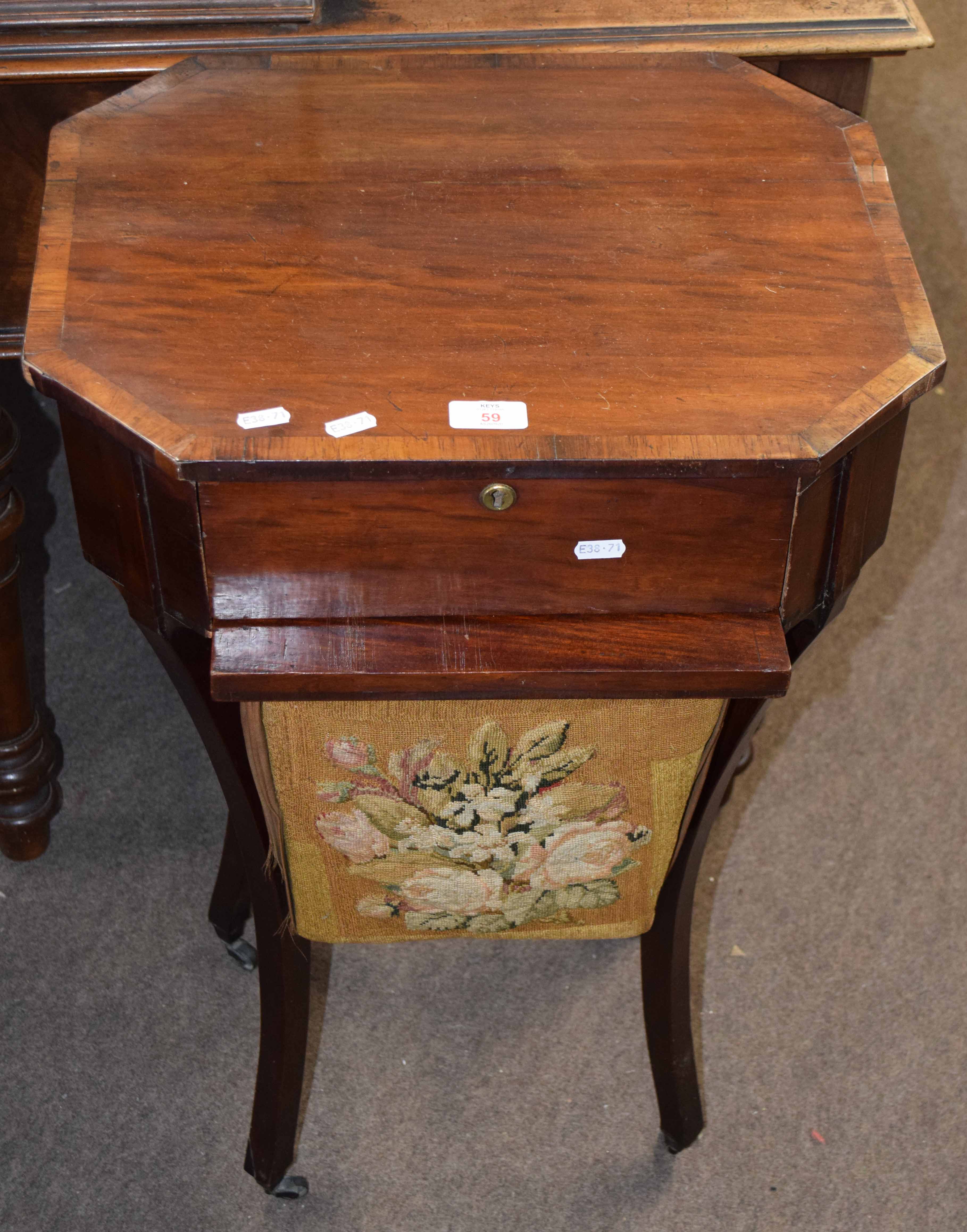 Late 19th century mahogany sewing table of octagonal form, fitted drawer over bag on swept